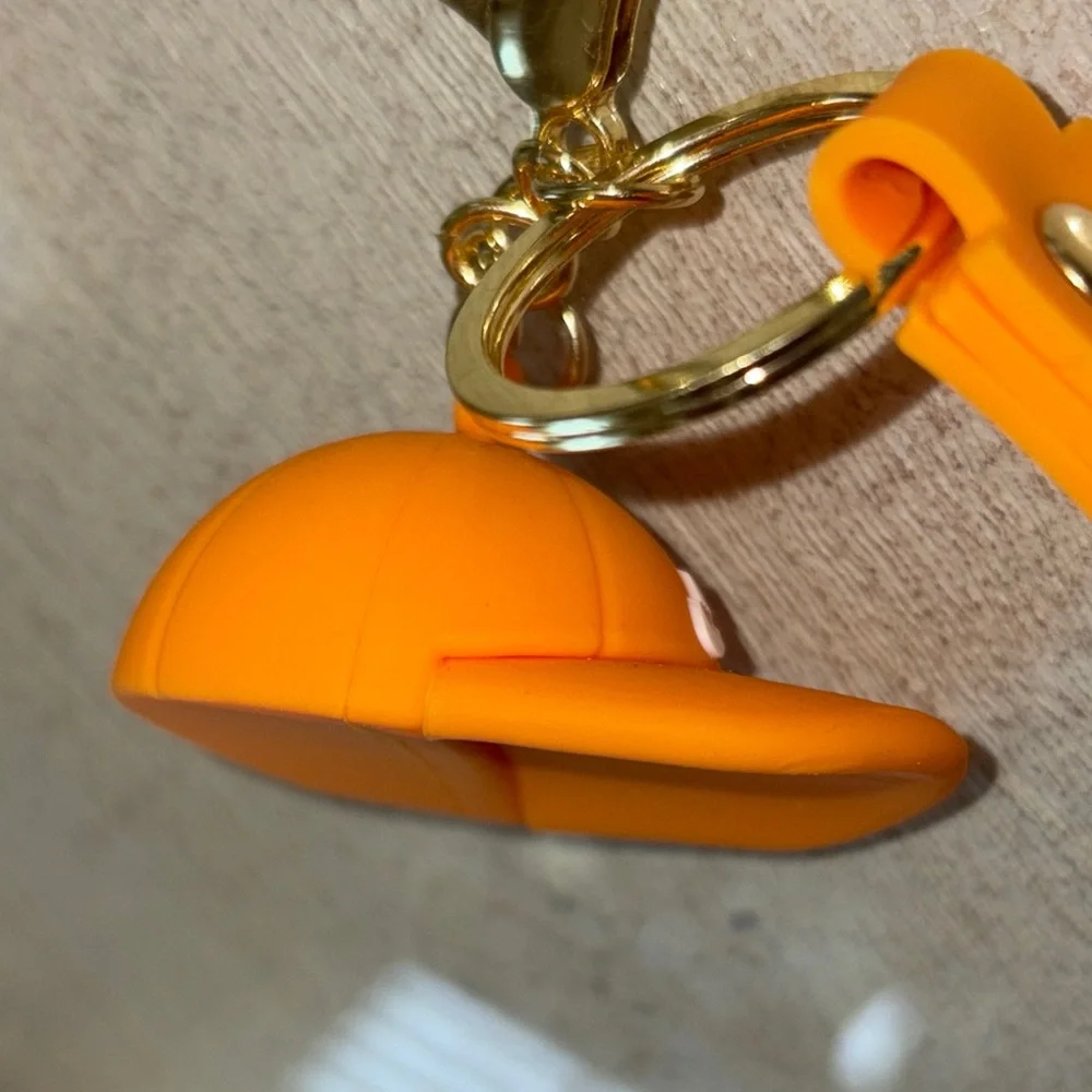 Nike Gold and Orange Cap Keychain